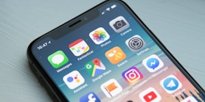 iPhone手机屏幕上显示TVT体育应用界面